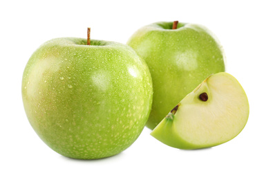 Image of Cut and whole green apples on white background