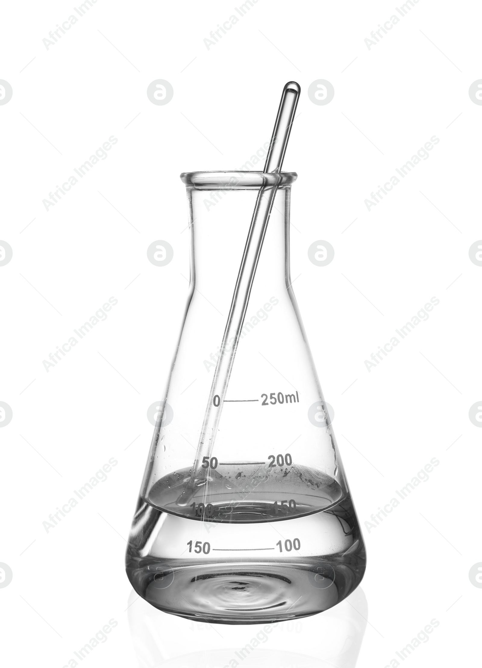 Photo of Glass flask with water and stirring rod isolated on white