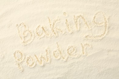 Words Baking Powder written on powder, top view