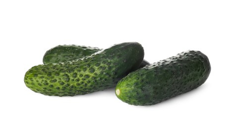 Photo of Whole fresh green cucumbers on white background