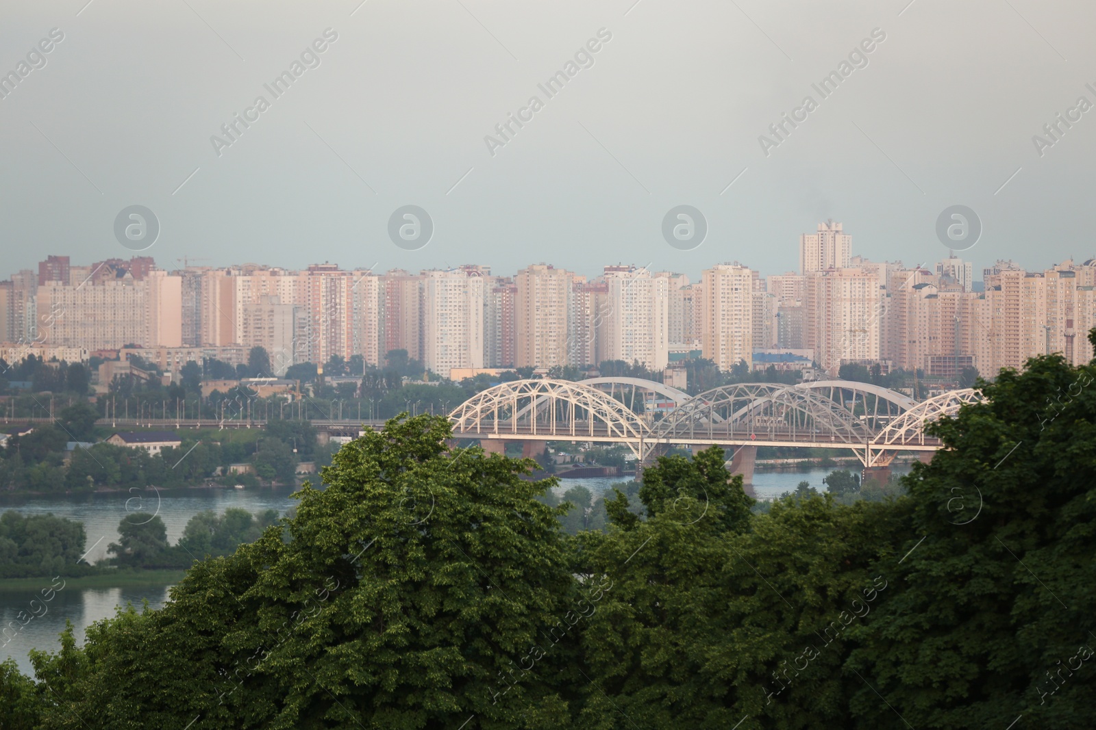 Photo of KYIV, UKRAINE - MAY 23, 2019: Beautiful view of Darnitsky railway bridge over Dnipro river