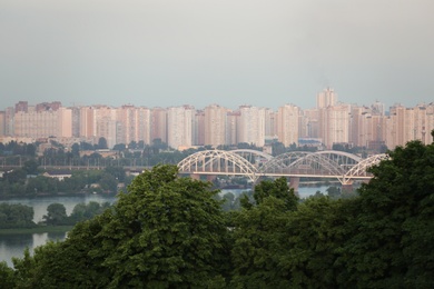 Photo of KYIV, UKRAINE - MAY 23, 2019: Beautiful view of Darnitsky railway bridge over Dnipro river