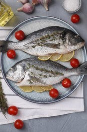 Photo of Flat lay composition with raw dorado fish on grey table