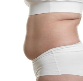 Photo of Woman with excessive belly fat on white background, closeup. Overweight problem