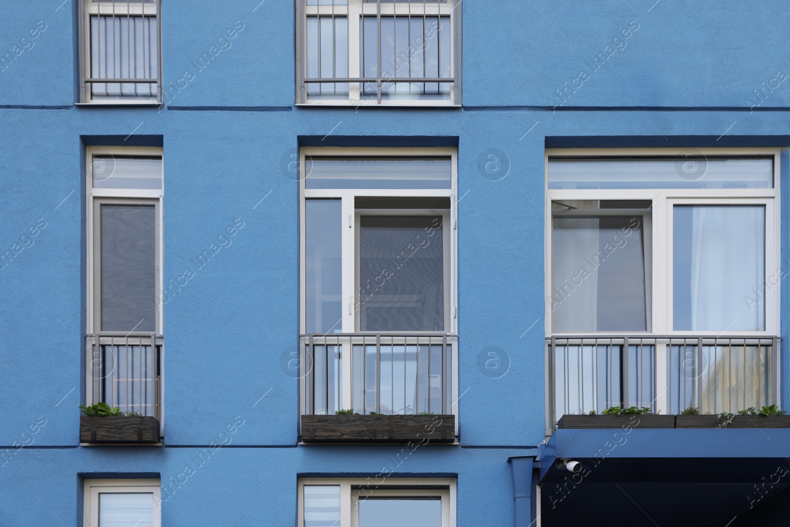 Photo of Colorful modern building with windows. Urban architecture