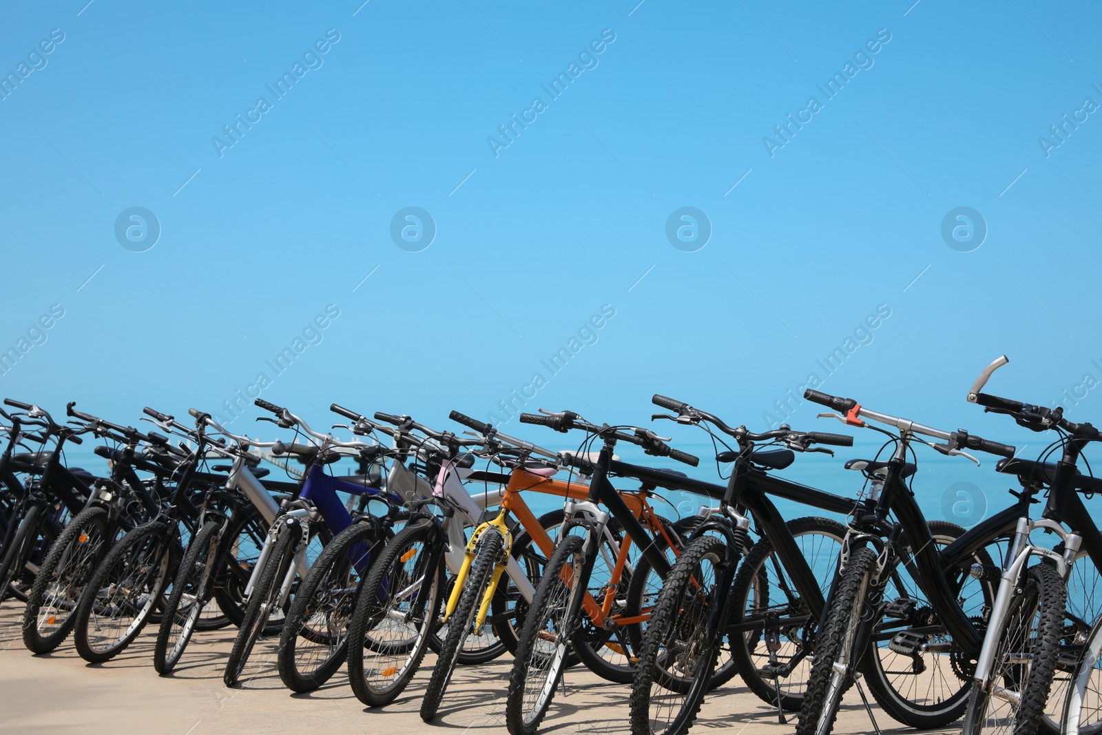 Photo of Parking with bicycles on embankment near sea