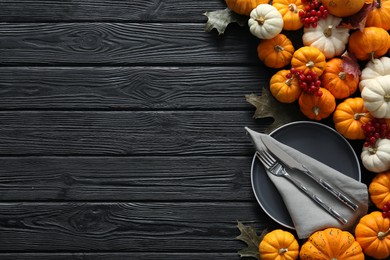 Happy Thanksgiving day. Beautiful table setting with autumn leaves, berries and pumpkins, flat lay, Space for text