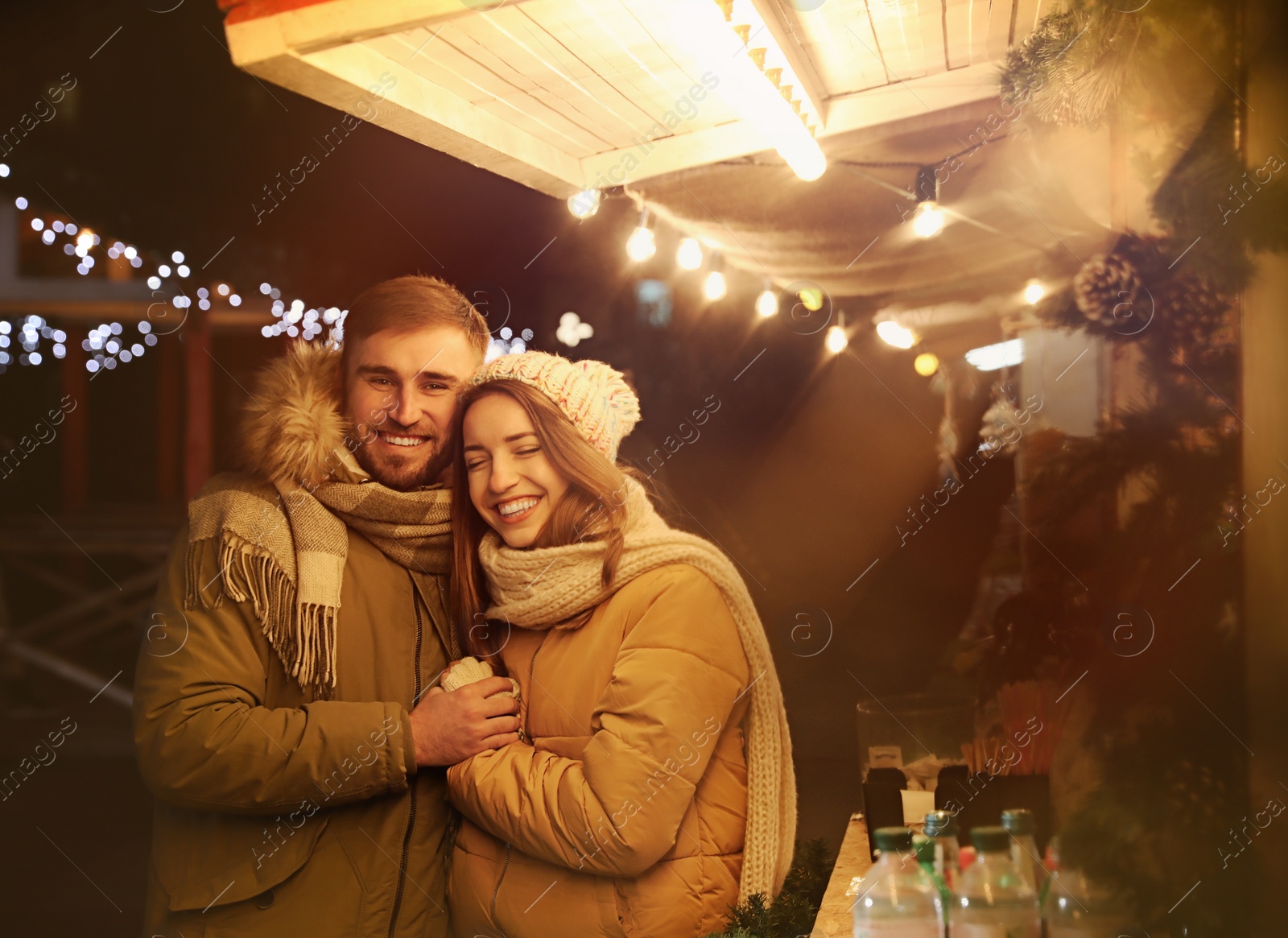 Photo of Happy couple spending time at Christmas fair