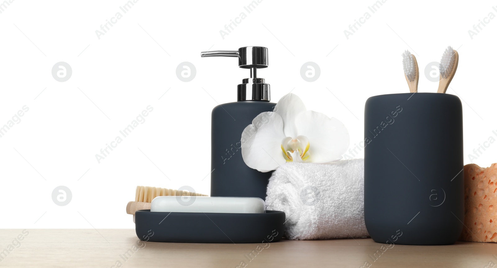 Photo of Bath accessories. Different personal care products and flower on wooden table against white background. Space for text