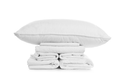 Pillow, bedding and towels on white background