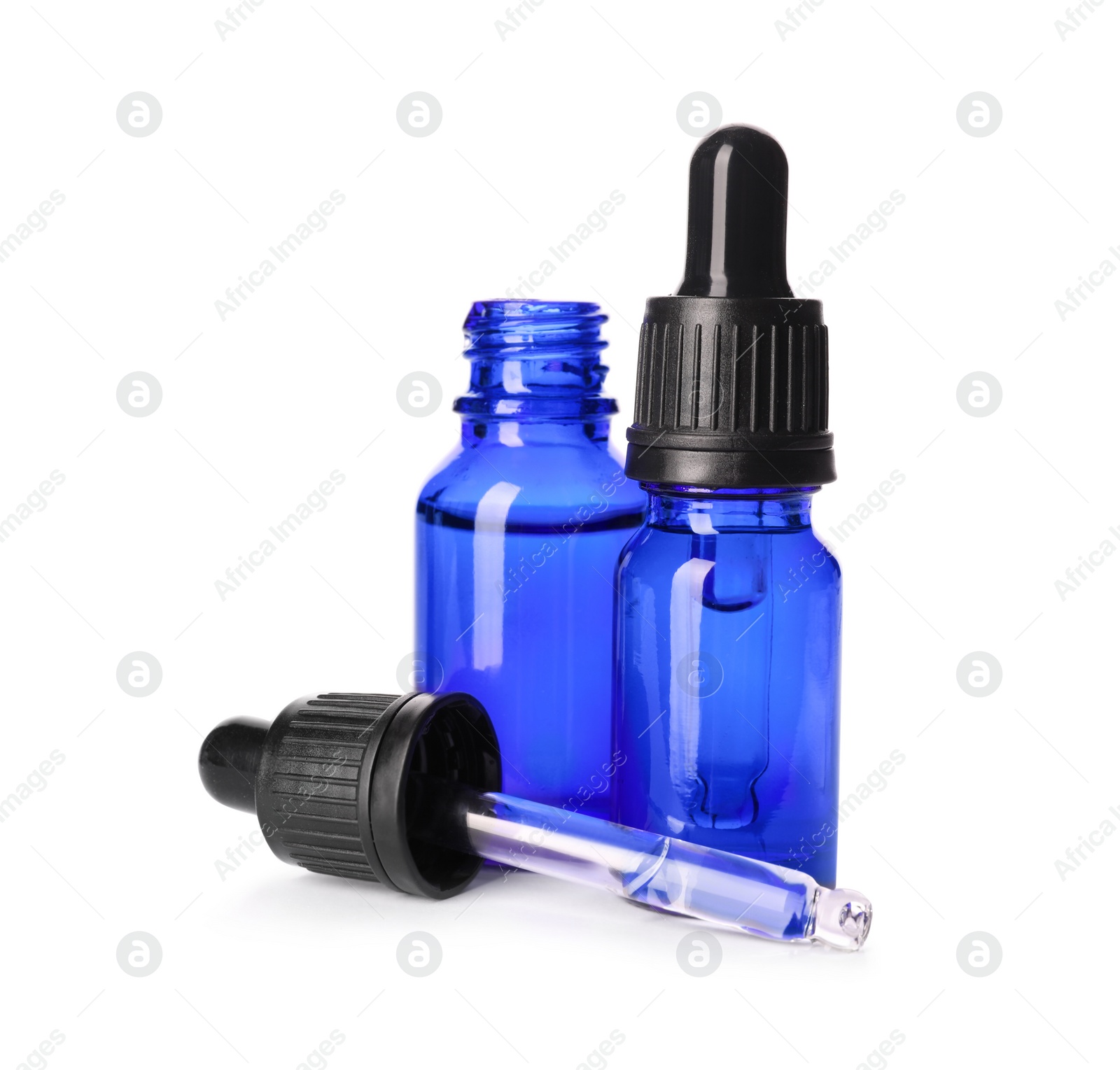 Photo of Cosmetic bottles of essential oils on white background