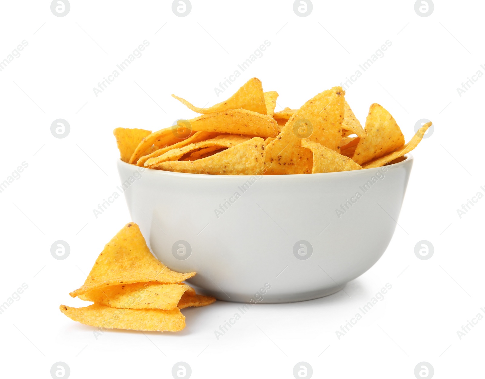 Photo of Ceramic bowl of Mexican nachos chips on white background