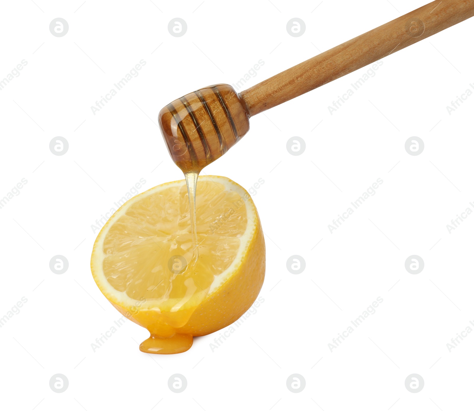 Photo of Dripping sweet honey from dipper onto fresh lemon on white background