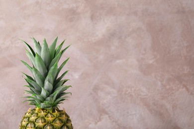 Photo of Delicious ripe pineapple on pink background. Space for text