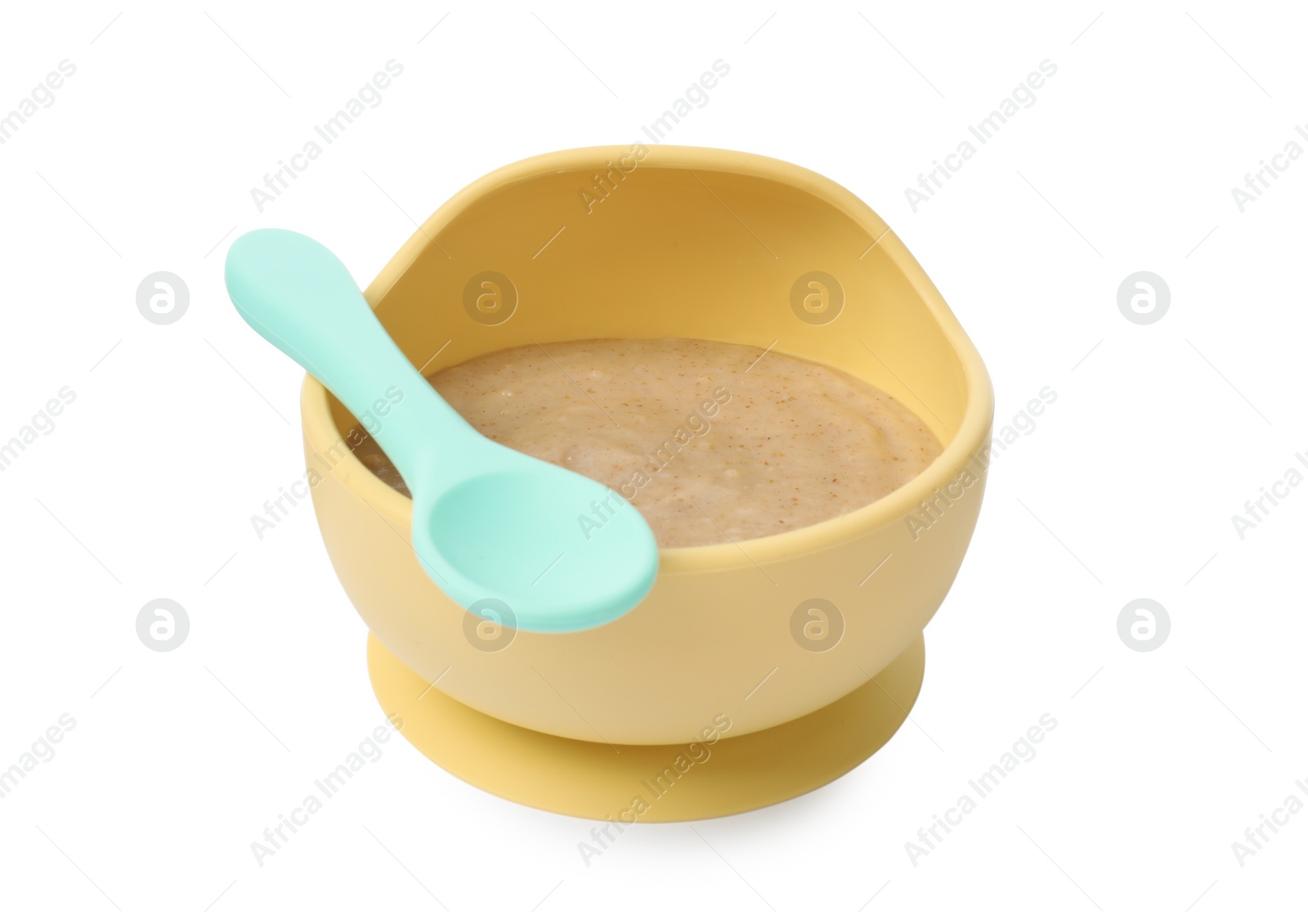 Photo of Tasty baby food in bowl and spoon isolated on white