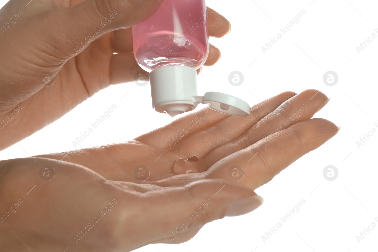 Photo of Woman applying antibacterial hand gel against white background, closeup