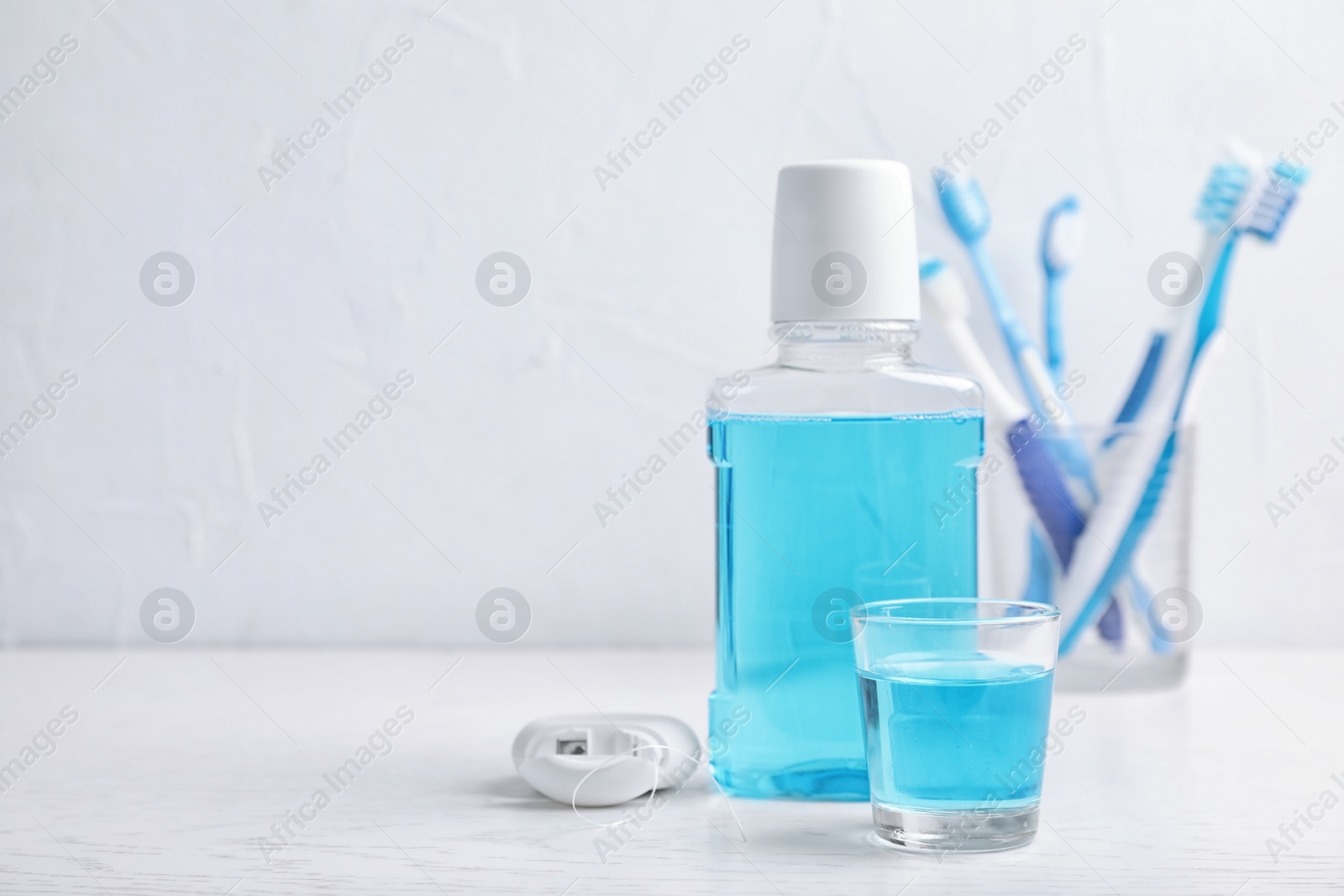 Photo of Oral care products and space for text on light background. Teeth hygiene