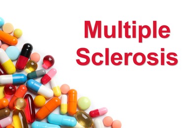 Multiple sclerosis treatment. Many different pills on white background, top view