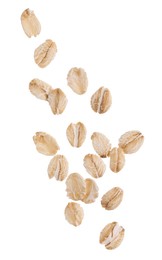 Photo of Dry oat flakes falling on white background