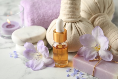 Photo of Spa composition with skin care products on white table, closeup