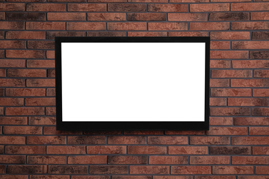 Modern TV on brick wall. Space for design