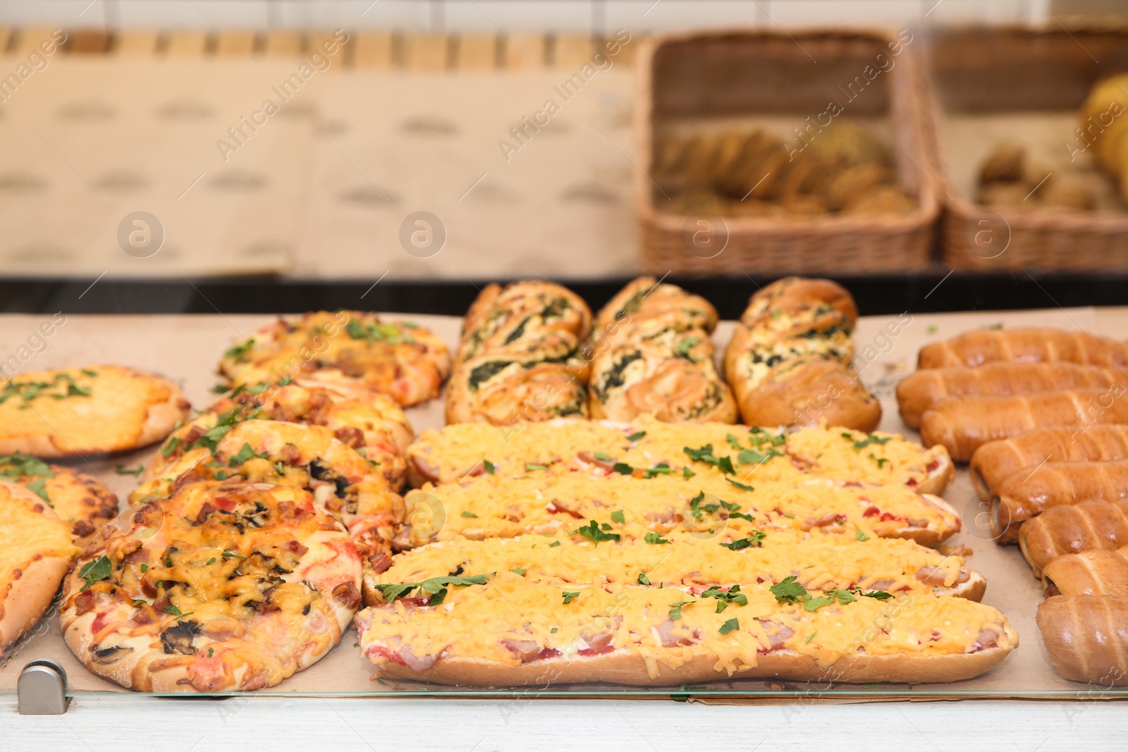 Photo of Fresh pastries on counter in bakery store