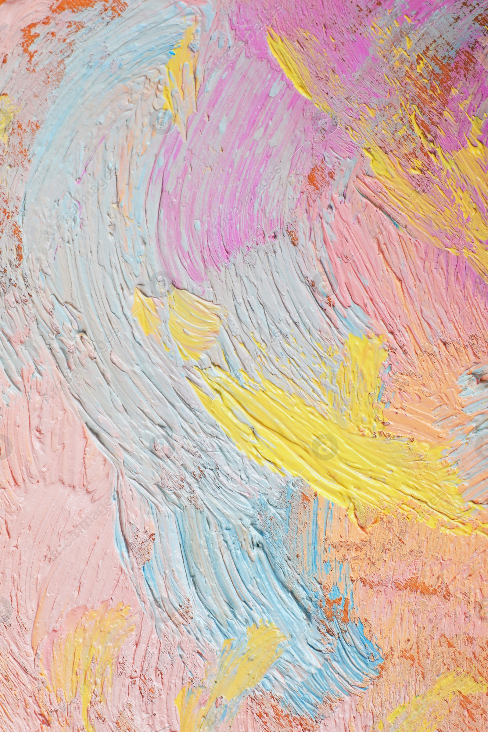 Photo of Closeup view of artist's palette with mixed pastel paints as background