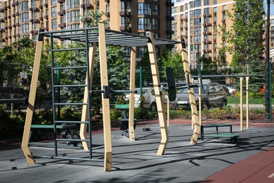 Empty outdoor gym with different sport simulators in residential area