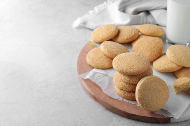 Photo of Many tasty sugar cookies on light grey table, space for text