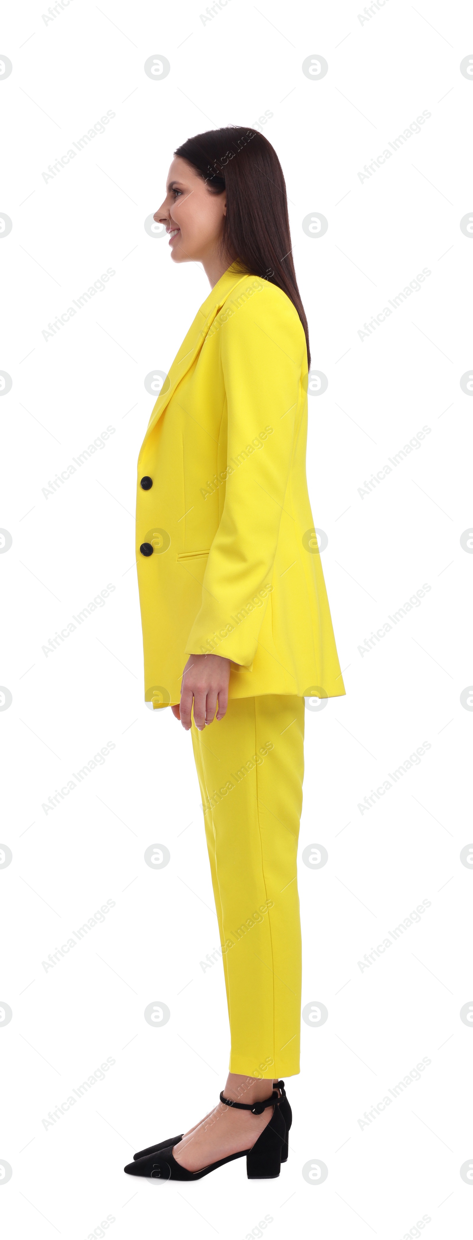 Photo of Businesswoman in yellow suit standing on white background