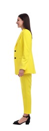 Photo of Businesswoman in yellow suit standing on white background