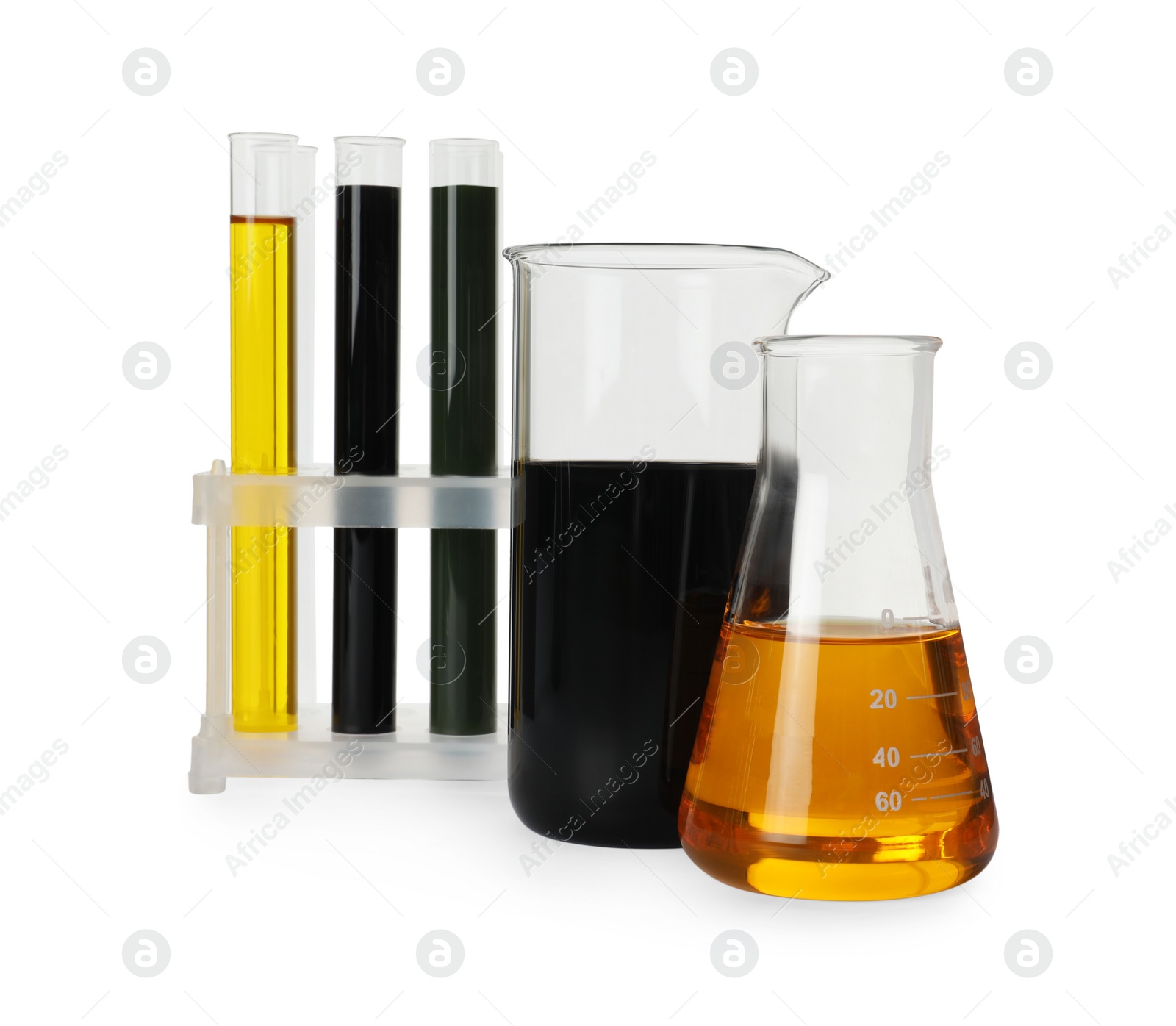 Photo of Laboratory glassware with different types of crude oil isolated on white