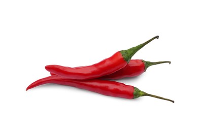 Photo of Red hot chili peppers on white background