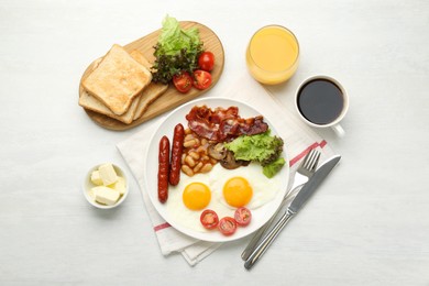 Photo of Delicious breakfast with sunny side up eggs served on white table, flat lay