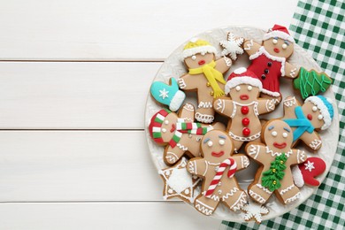 Delicious Christmas cookies on white wooden table, top view. Space for text