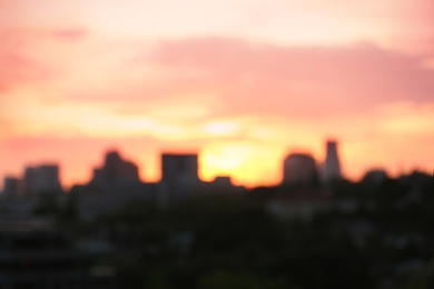 City district with modern buildings at sunset, bokeh effect