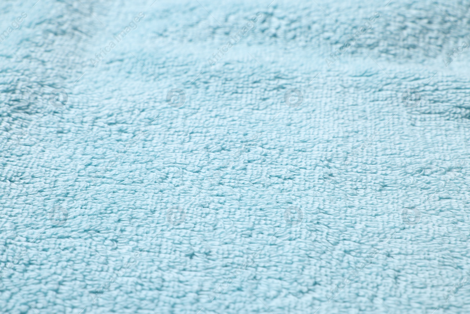 Photo of Texture of soft light blue fabric as background, closeup