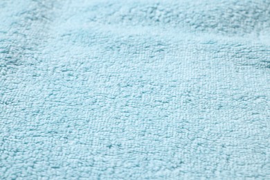 Photo of Texture of soft light blue fabric as background, closeup