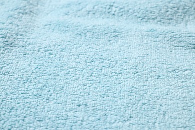 Texture of soft light blue fabric as background, closeup