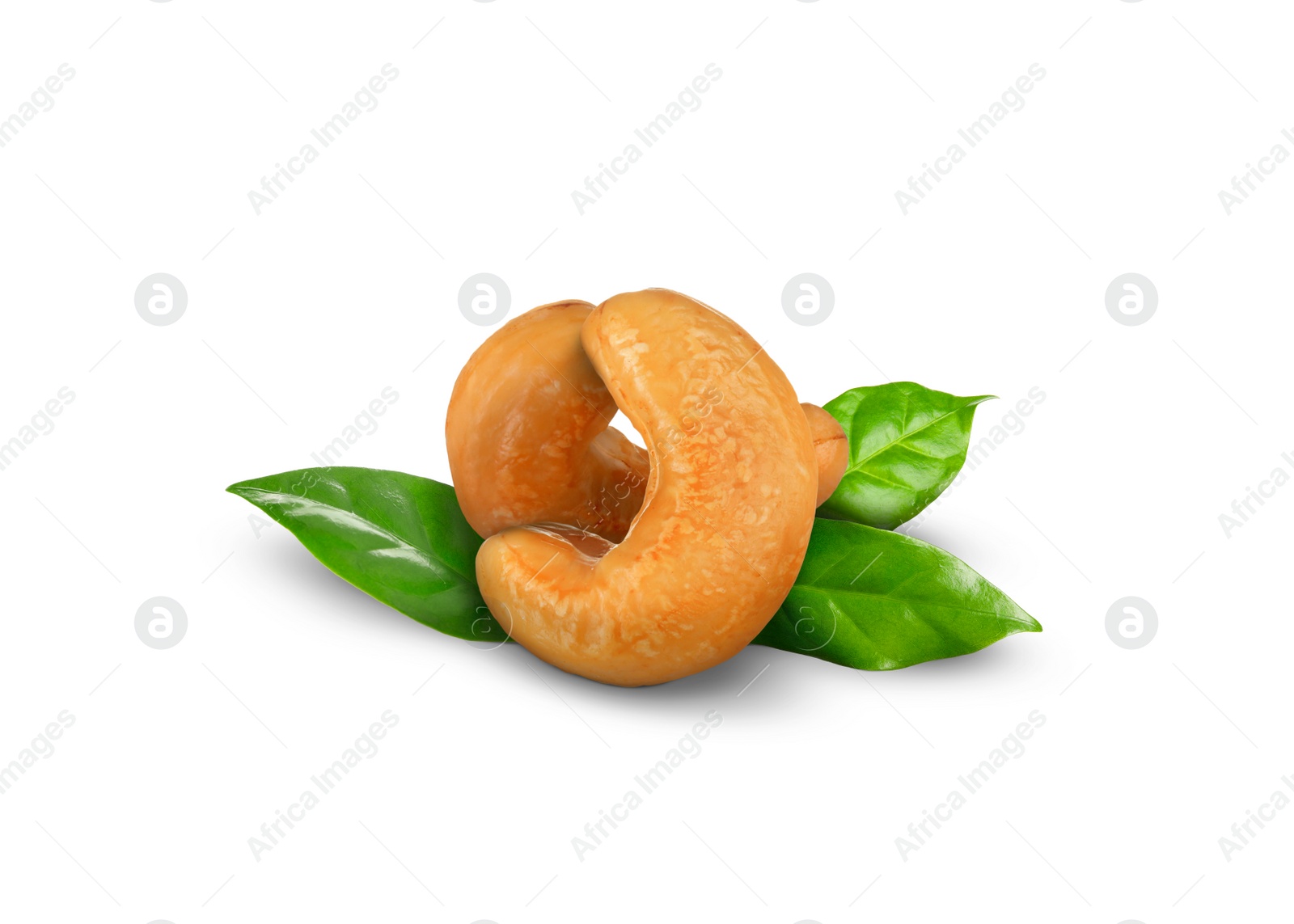 Image of Tasty cashew nuts and fresh green leaves on white background 