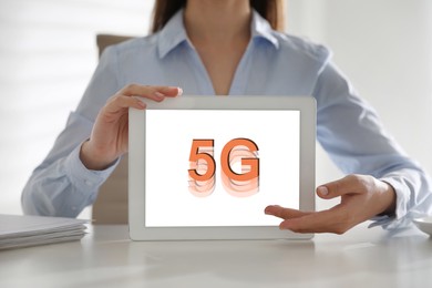 Image of Woman using tablet with 5G network system indoors, closeup