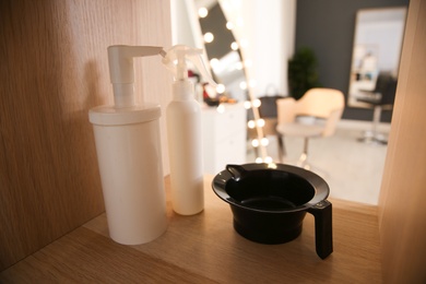 Shelf with hair dye kit in beauty salon