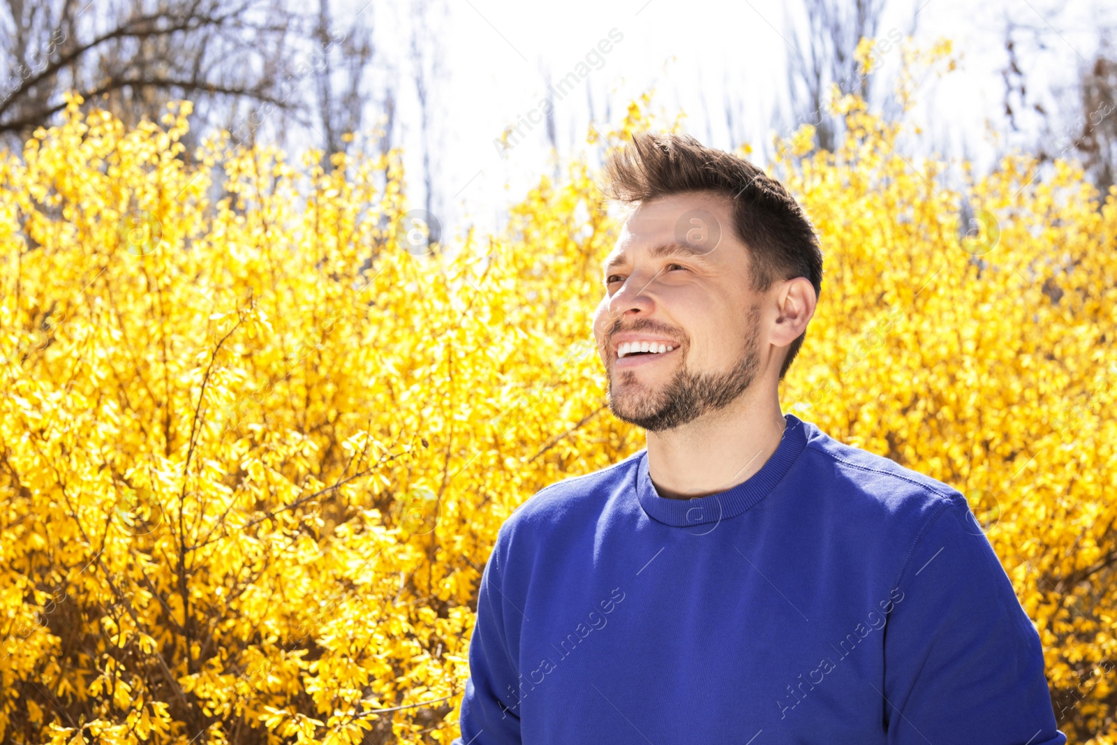 Photo of Happy healthy man enjoying springtime outdoors, space for text. Allergy free concept