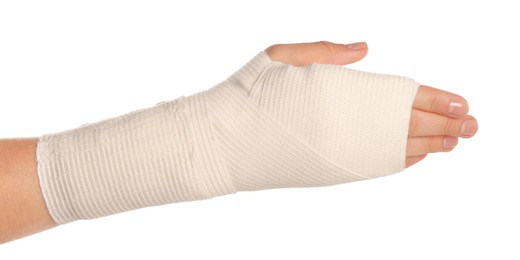 Photo of Woman with hand wrapped in medical bandage on white background, closeup