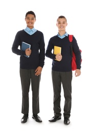 Photo of Full length portrait of teenage boys in school uniform on white background