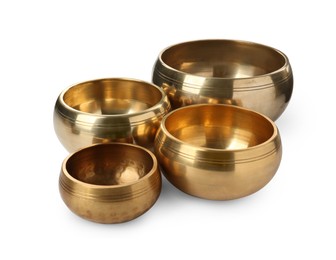 Photo of Four Tibetan singing bowls on white background