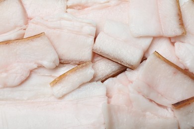 Pieces of tasty salt pork as background, top view
