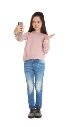 Little girl using video chat on smartphone, white background