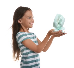 Photo of Little girl enjoying air flow from portable fan on white background. Summer heat