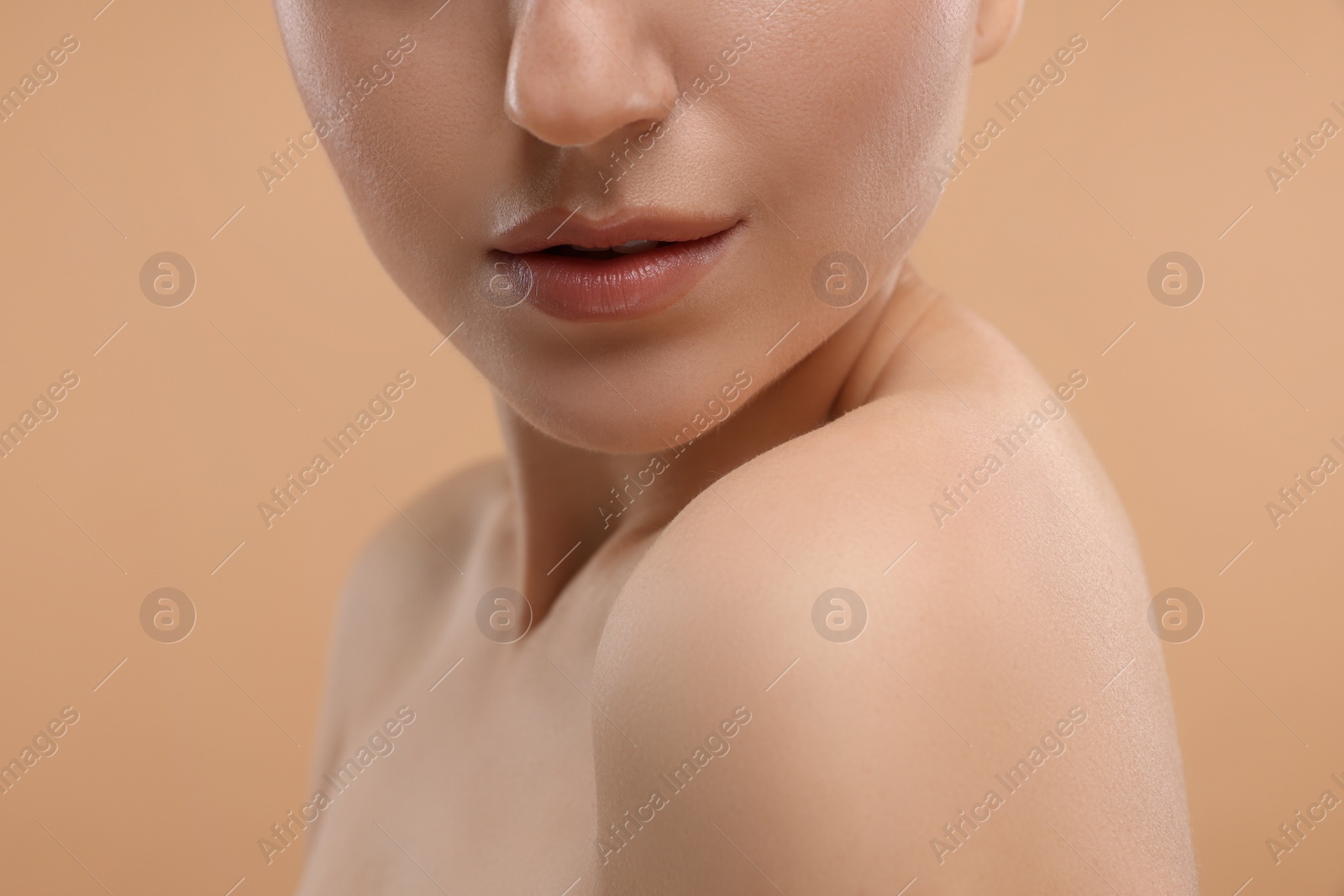 Photo of Beauty concept. Woman on beige background, closeup